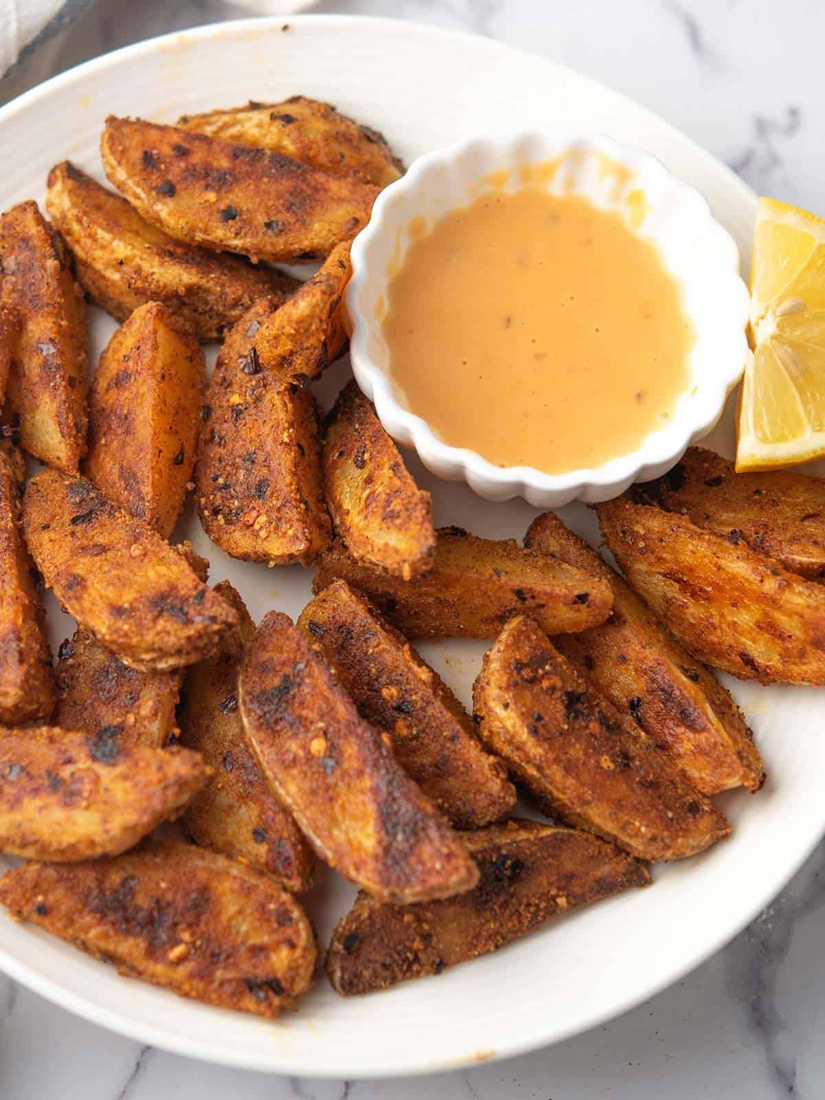 spicy potato wedges served with the dipping sauce.