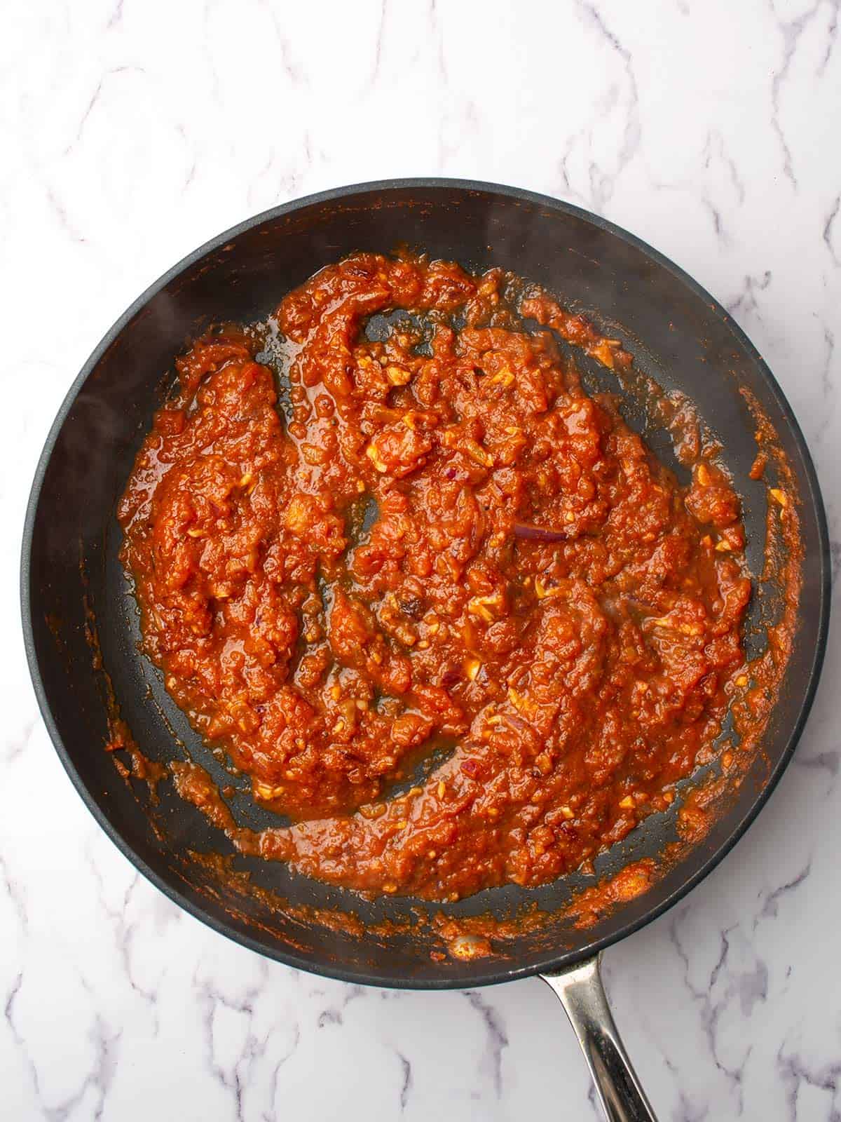 making the harissa infused sauce