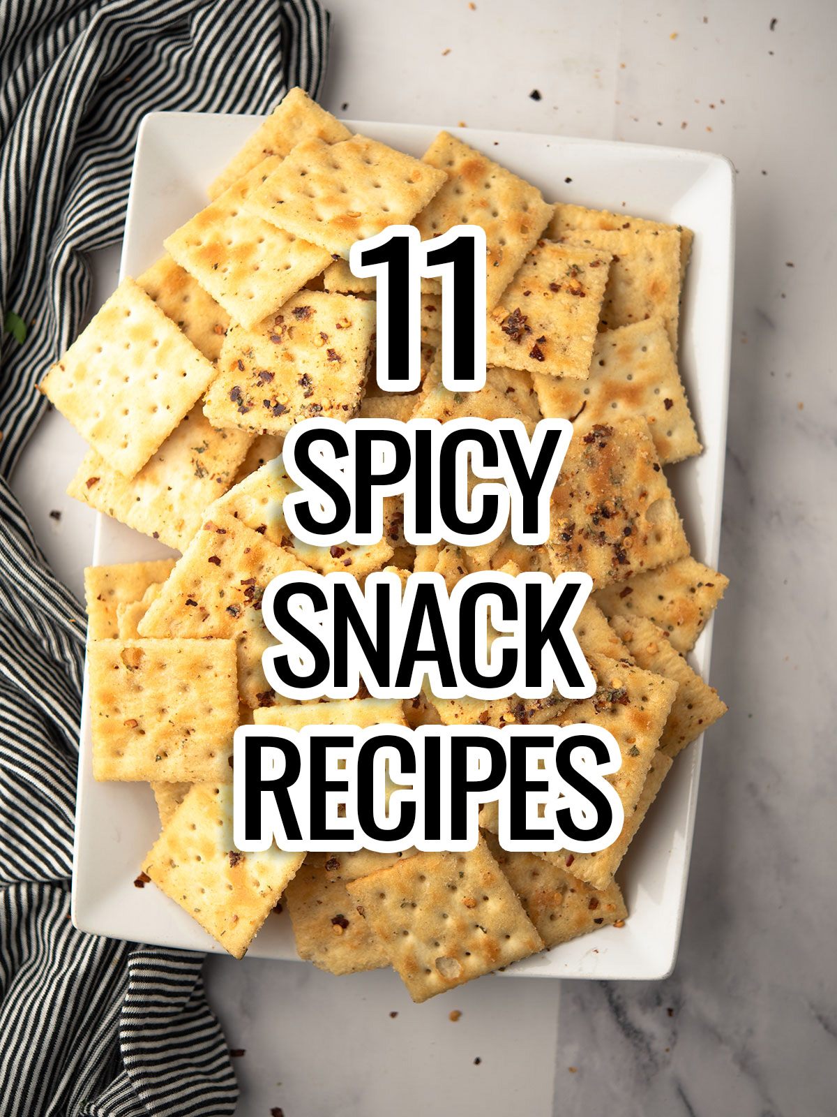 The text spicy snack recipes placed on the spicy crackers.are