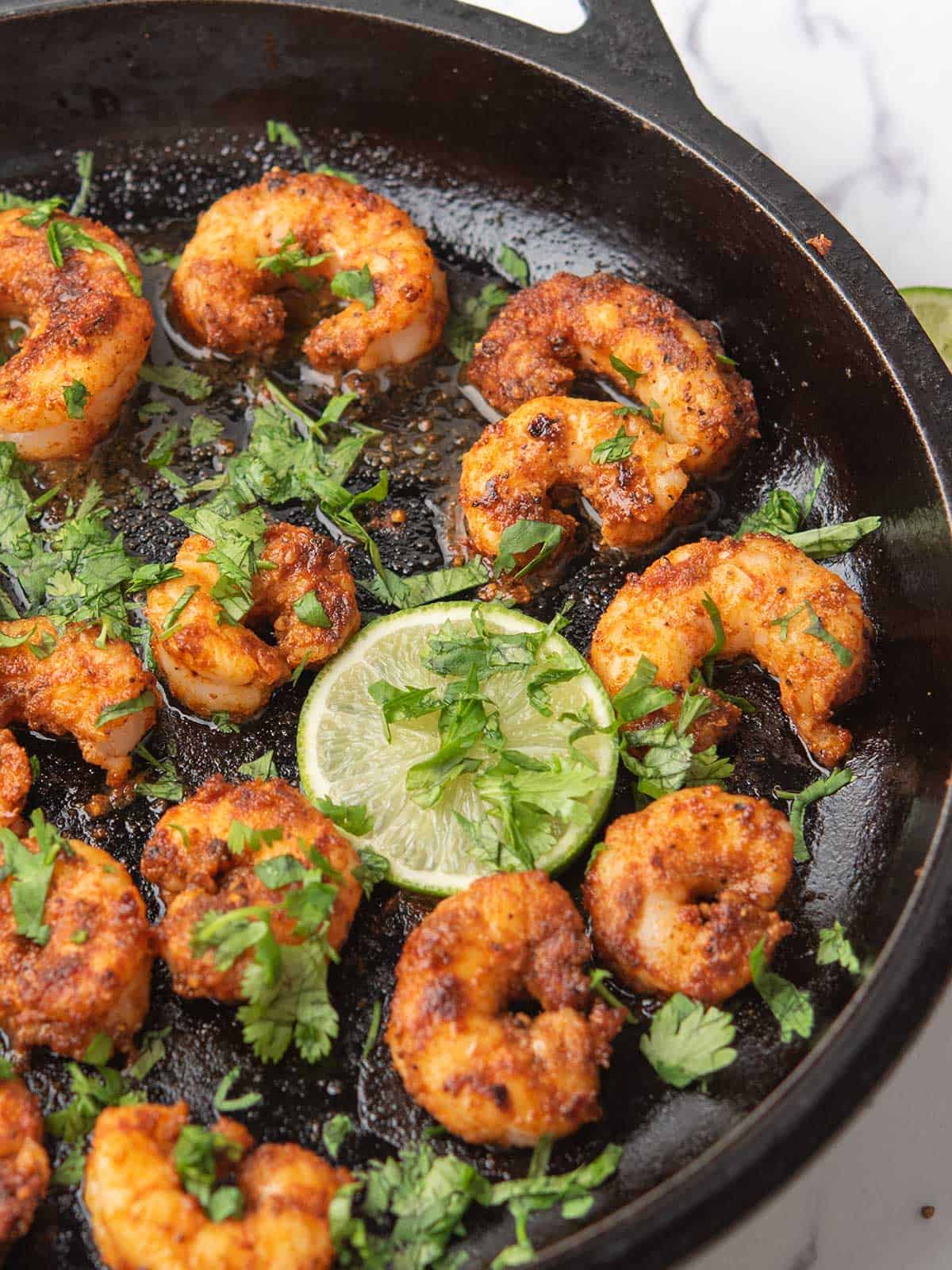 chili lime shrimp with freshly squeezed lime juice and cilantro garnish.