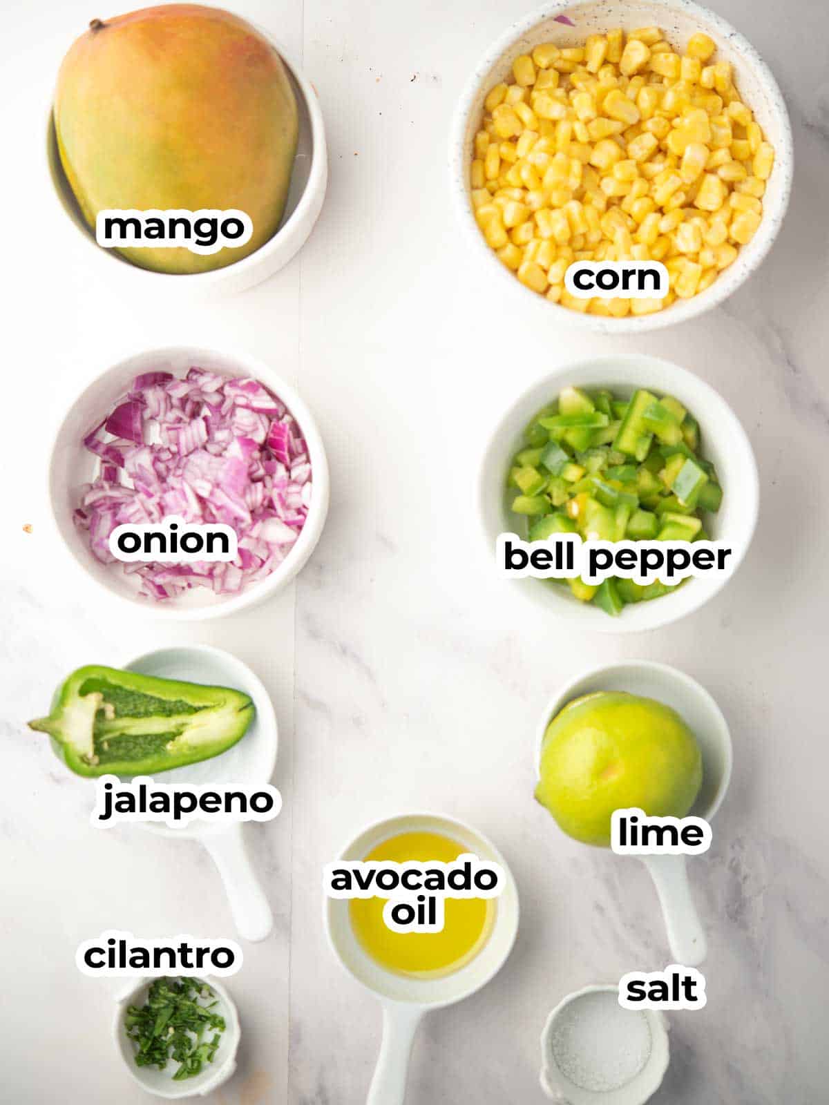 mango corn salsa ingredients assembled in the kitchen counter