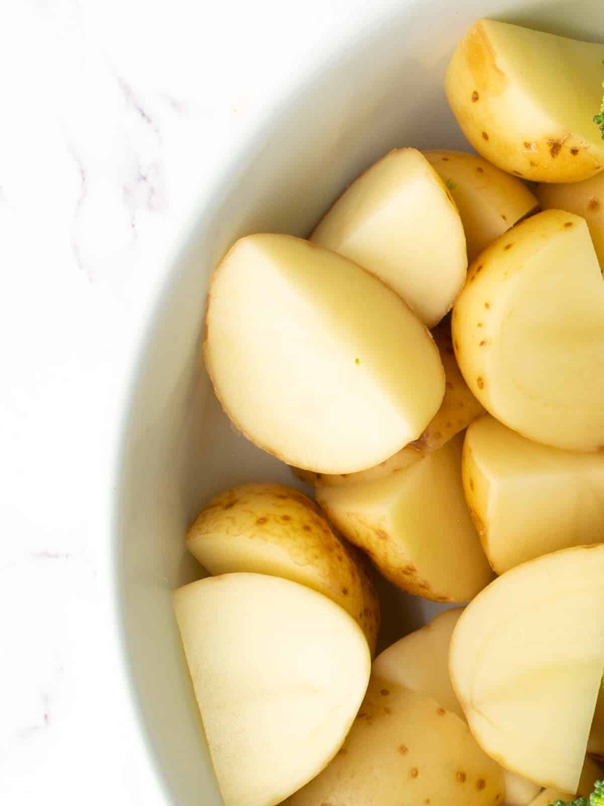 chopped potatoes are placed in a bowl