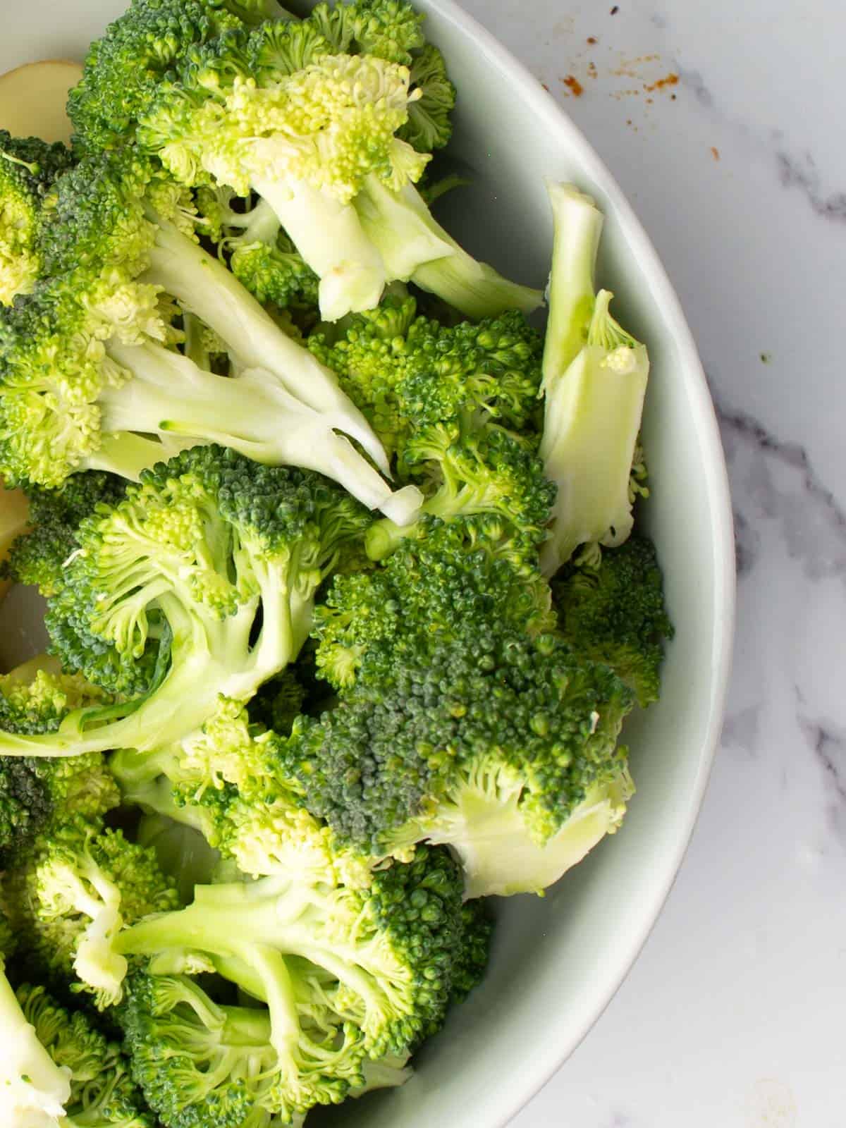 broccoli florets are placed in a bowl