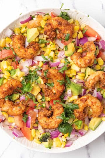 corn and shirmp salad, with tomato, avocado, red onion, ready to enjoy for this summer weeknight dinner.