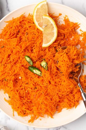 indian carrot salad served as the side dish over the dinner table.