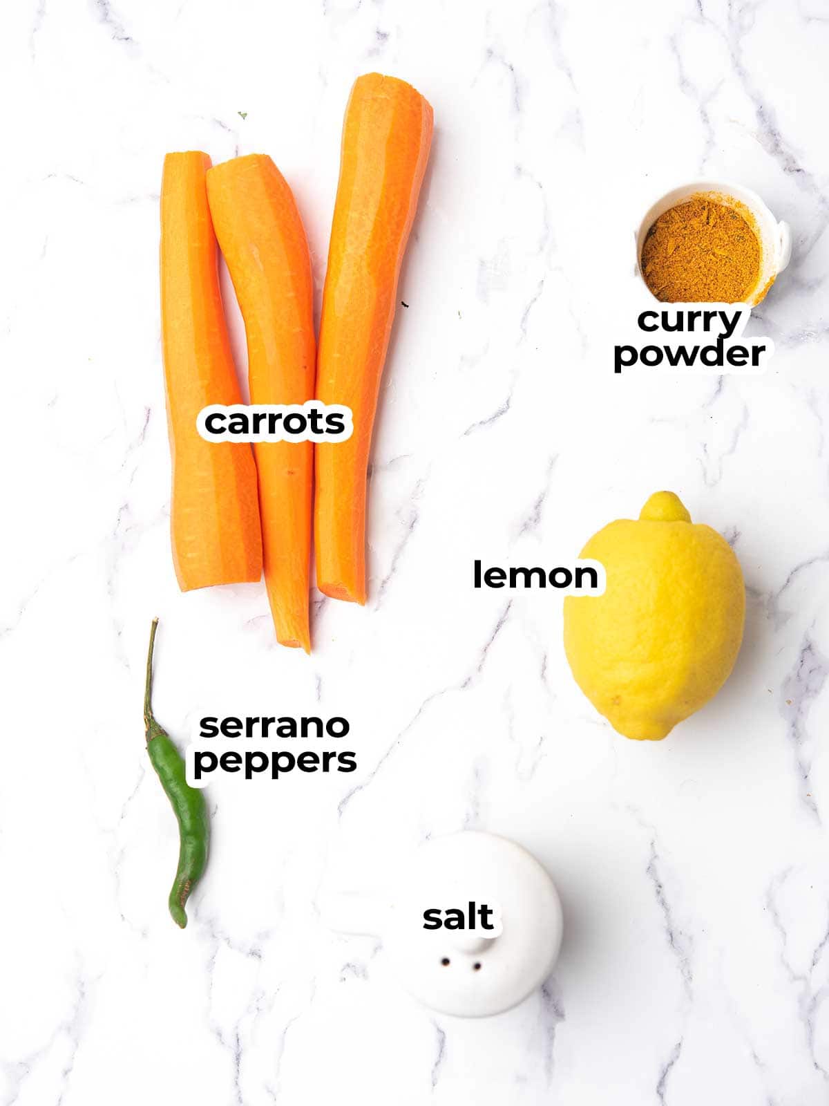 the ingredients for the indian carrot salad assembled in the kitchen counter.