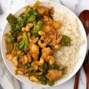 Chinese cashew chicken stir fried with broccoli and garlic sauce served with rice.