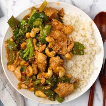 Chinese cashew chicken stir fried with broccoli and garlic sauce served with rice.