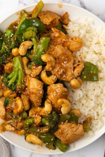 Chinese cashew chicken stir fried with broccoli and garlic sauce served with rice.