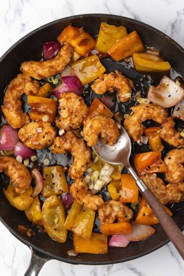 P F Changs style fire cracker shrimp, tossed with the glossy sauce and with peppers and onion.
