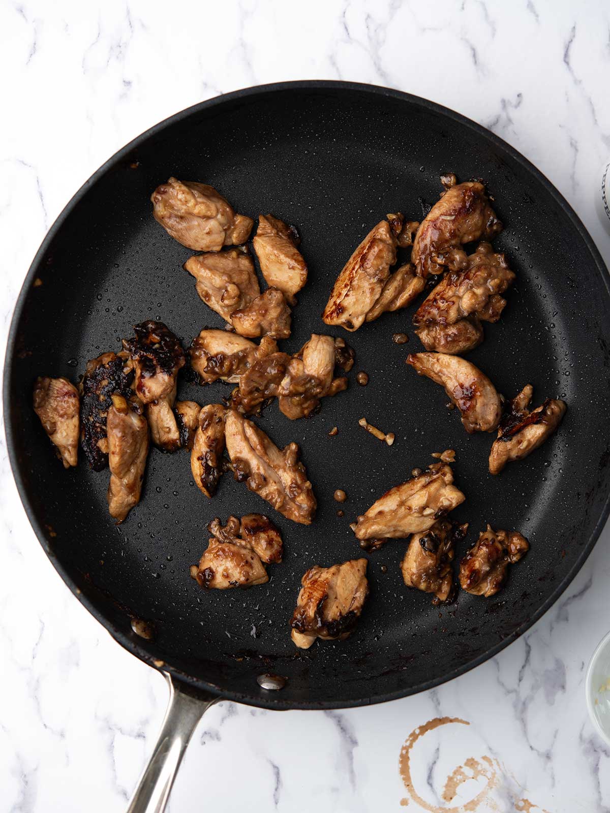 Teriyaki glaze added to the cooked chicken.