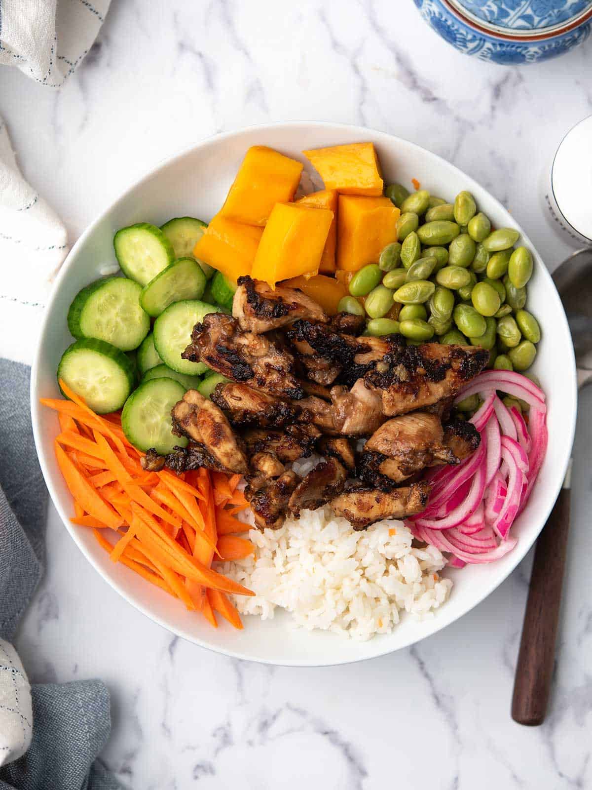 arrange all the ingredinets to the chicken poke bowl.