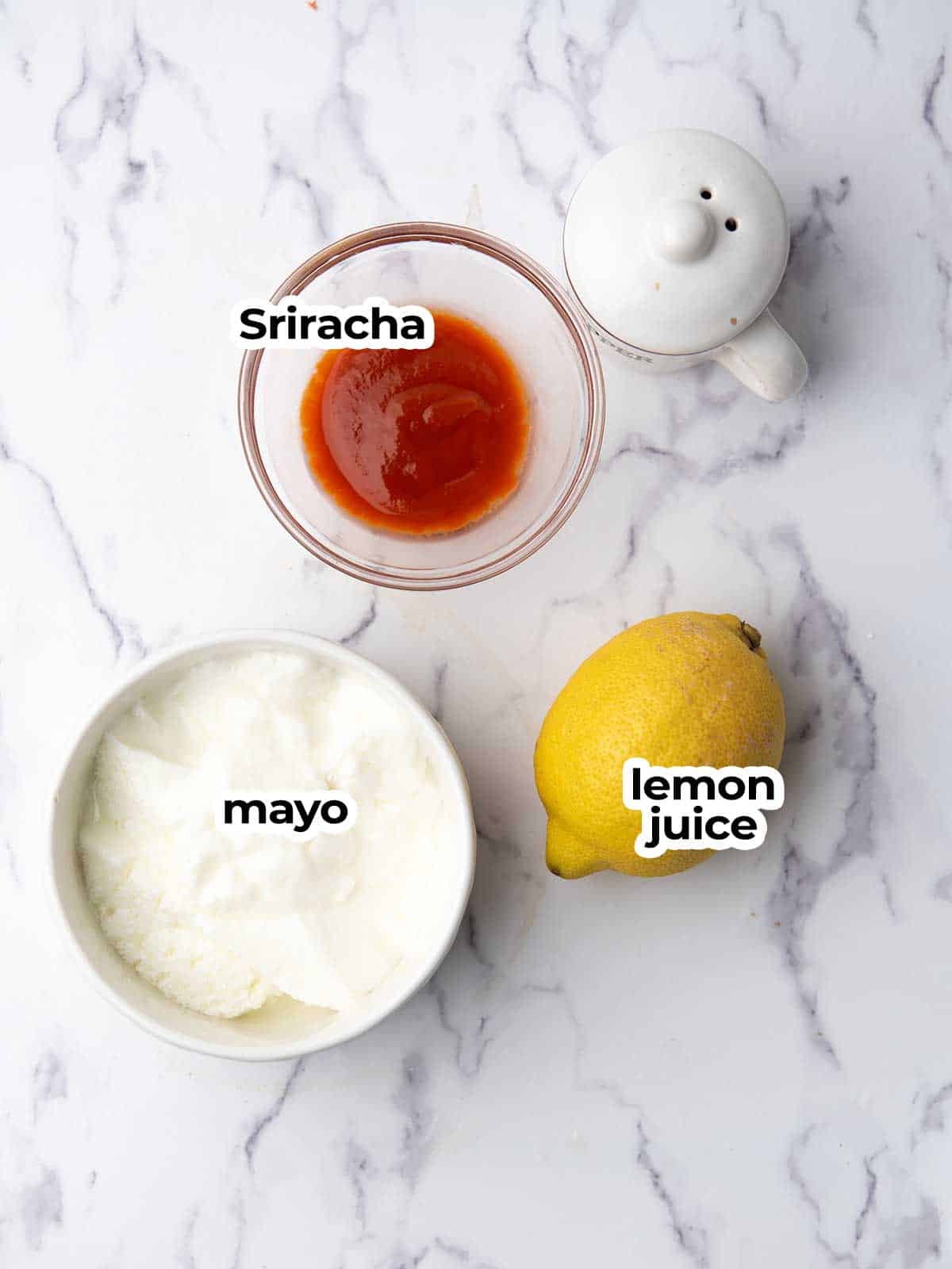 the sriracha mayo ingredients are ready for drizzling over teiyaki chicken poke bowl.