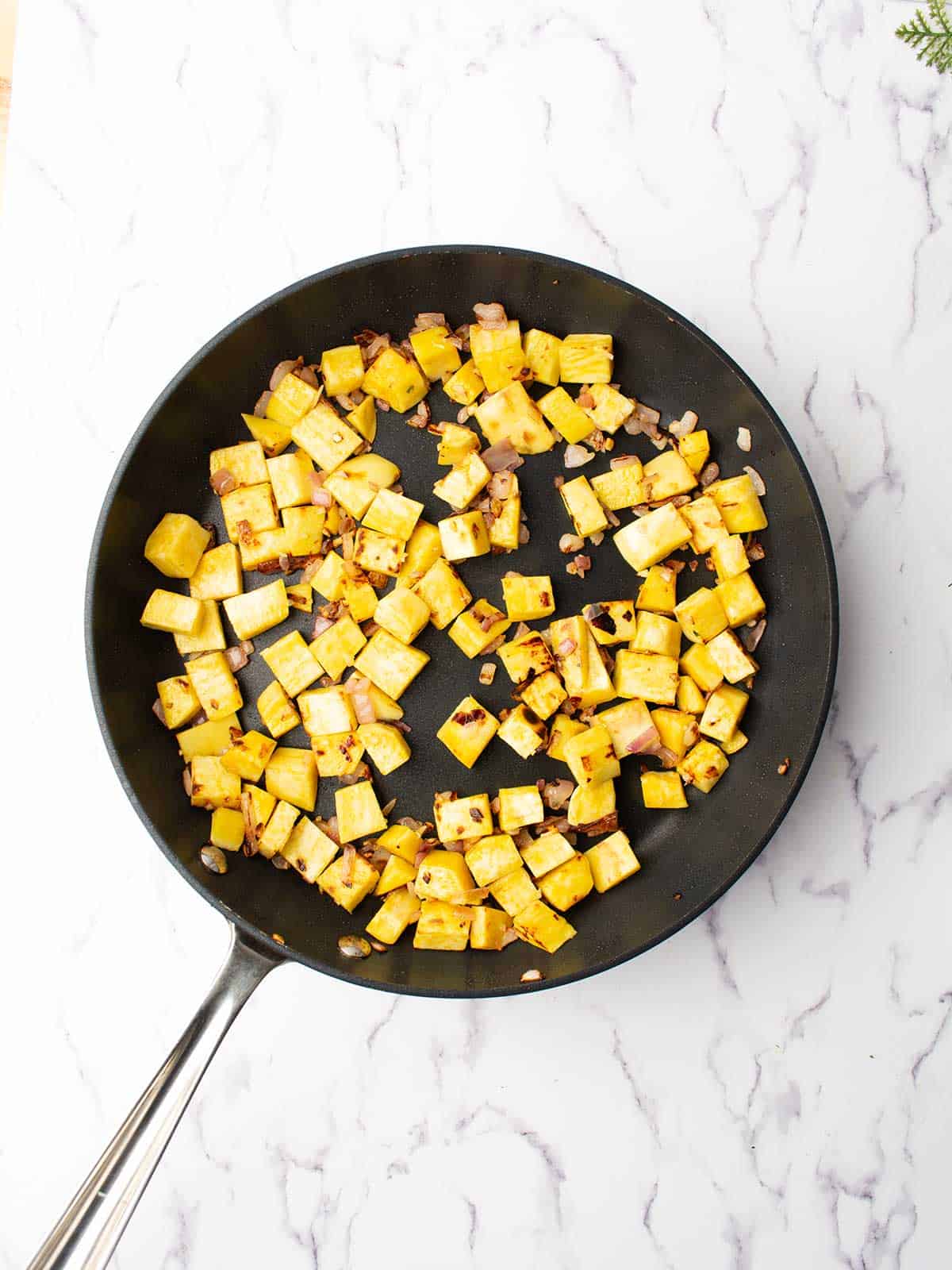 cooking sweet potatoes in the pan.