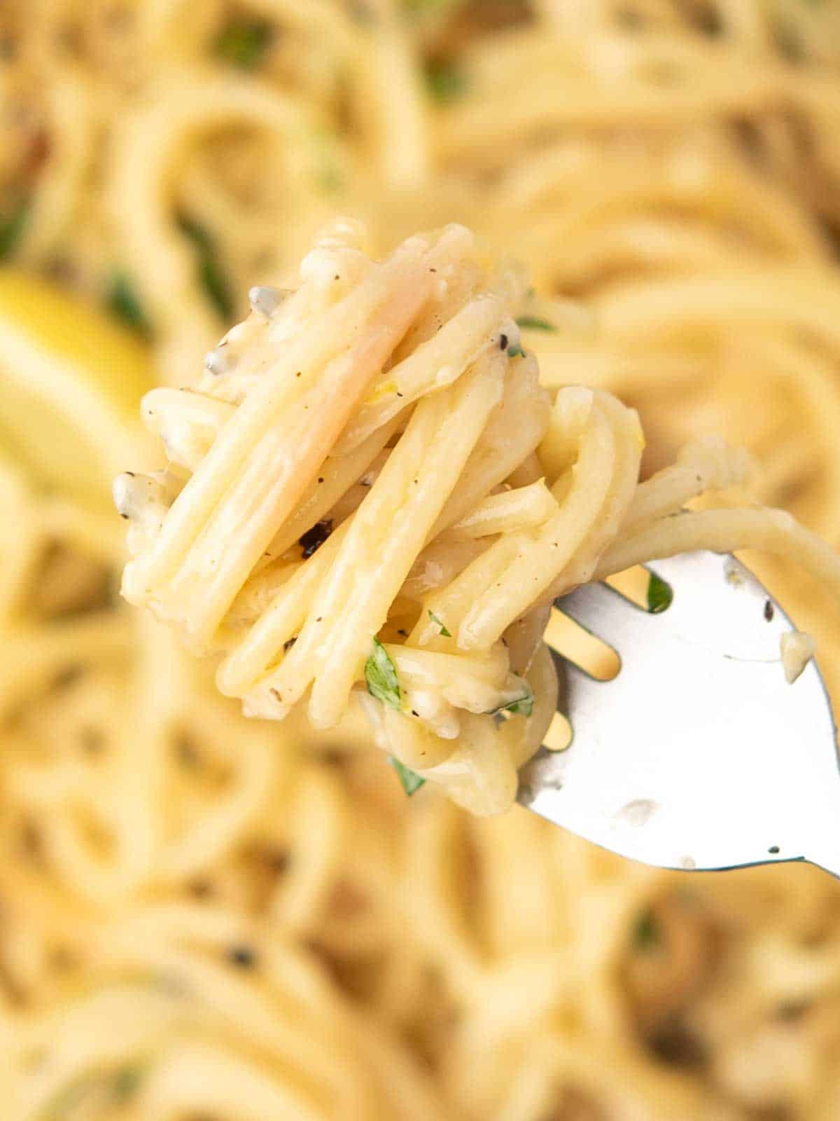 the spaghetti tossed in rich lemon pepper pasta, a close up view.