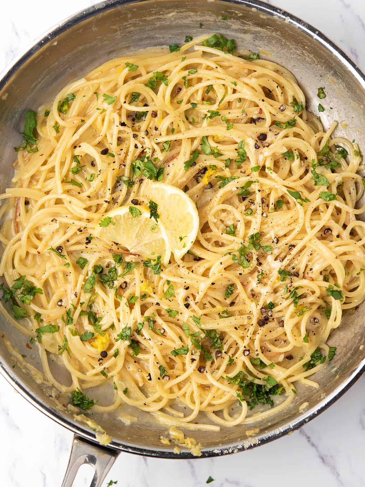 bright lemon pepper pasta cooked in the stove top, ready to serve for the weeknight dinner.